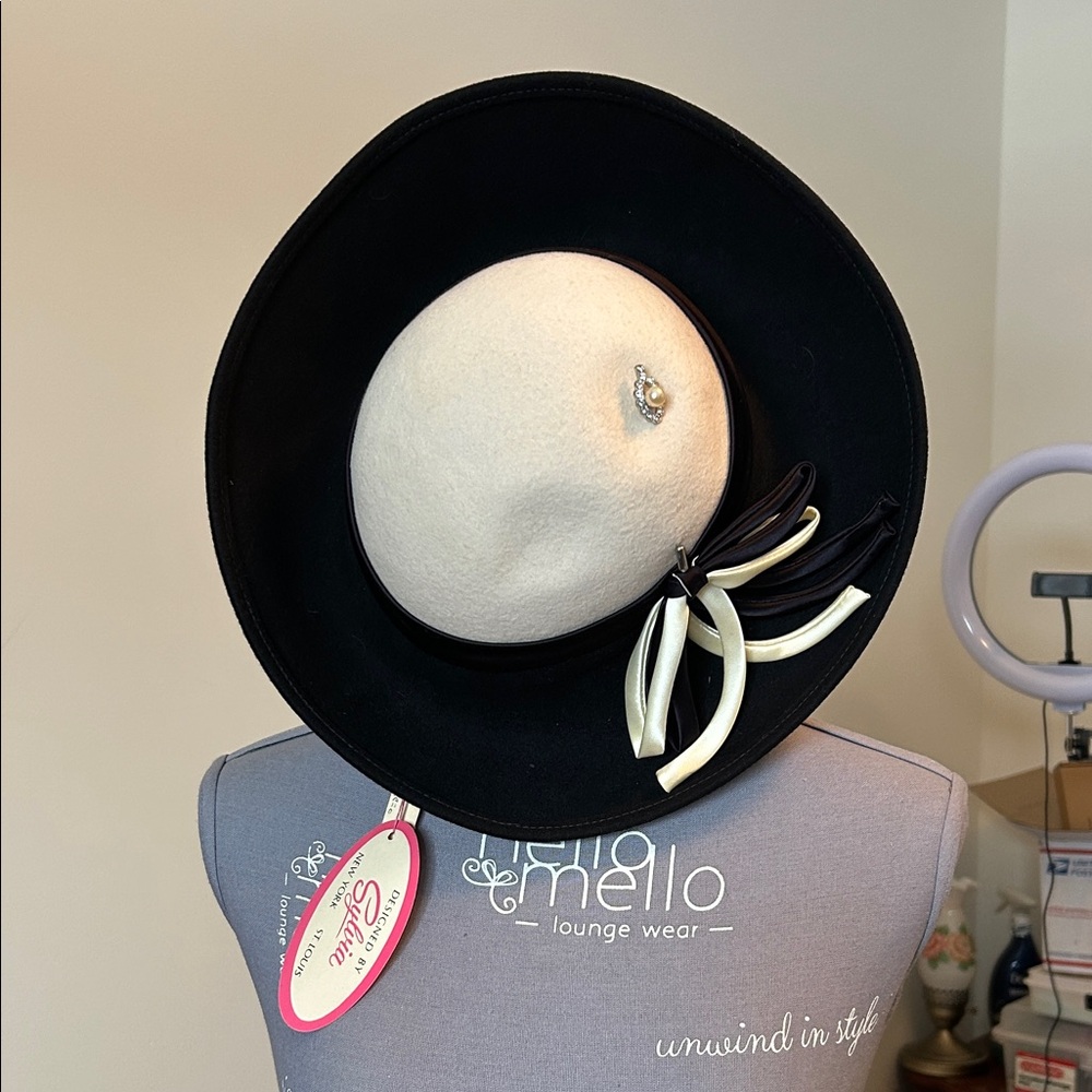Chic Black and Cream Hat with Bow Accent